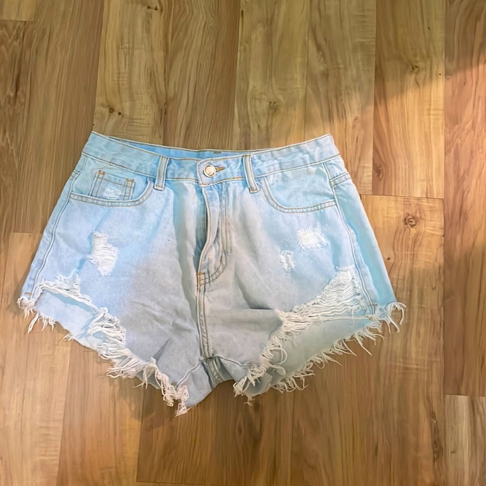 light blue ripped jean shorts